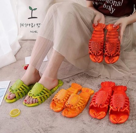 These lobster slippers are exactly that: bright red novelty slides shaped like a chunky lobster—complete with claws, shell texture, and “why is this so funny?” energy.